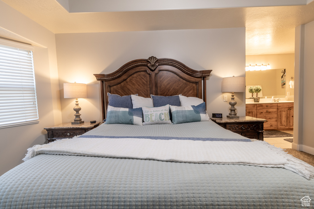 Bedroom featuring ensuite bath