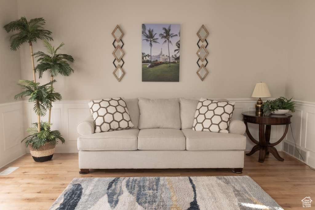 Living room with light wood-type flooring