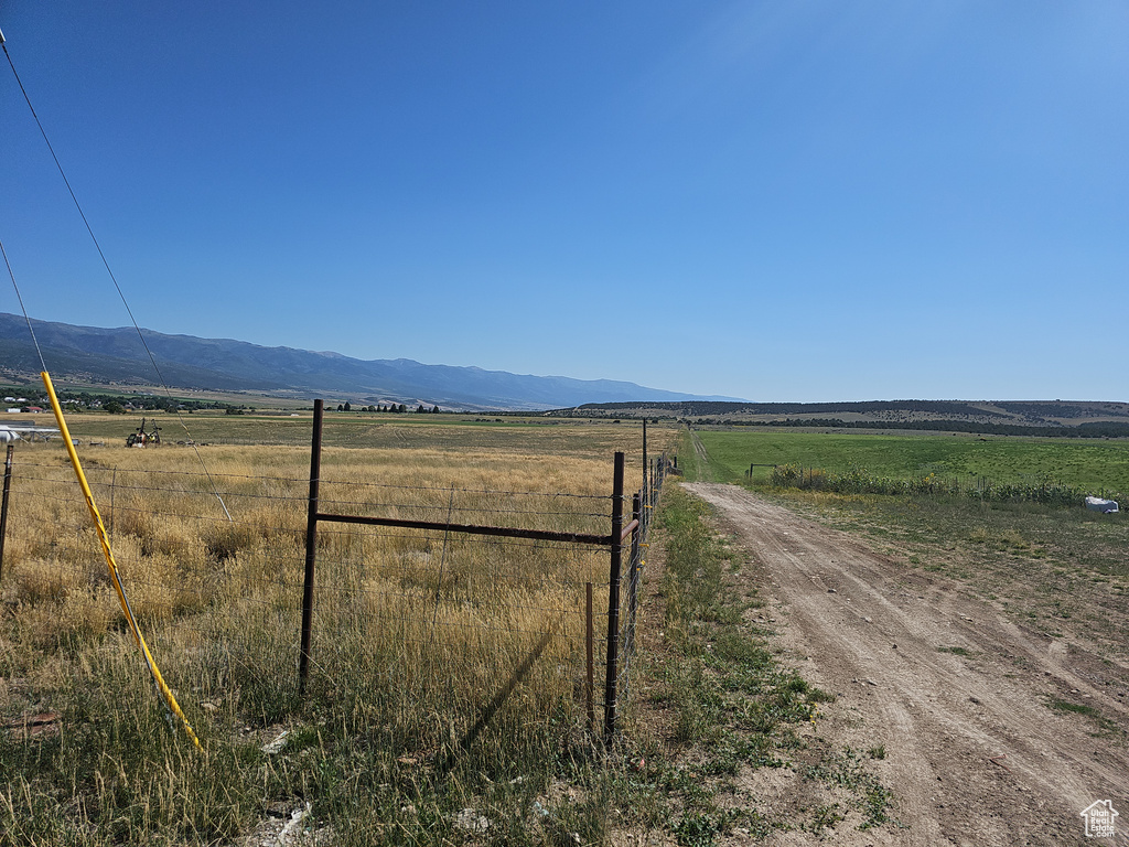 View of road with a rural view and a mountain view