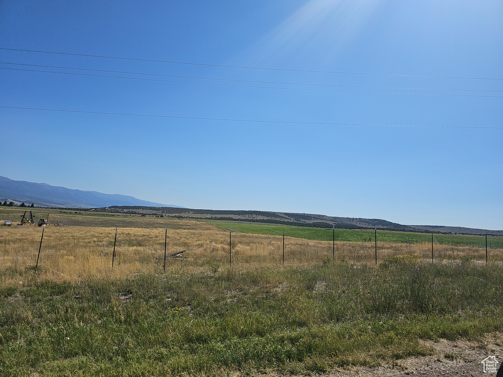 View of yard with a mountain view and a rural view