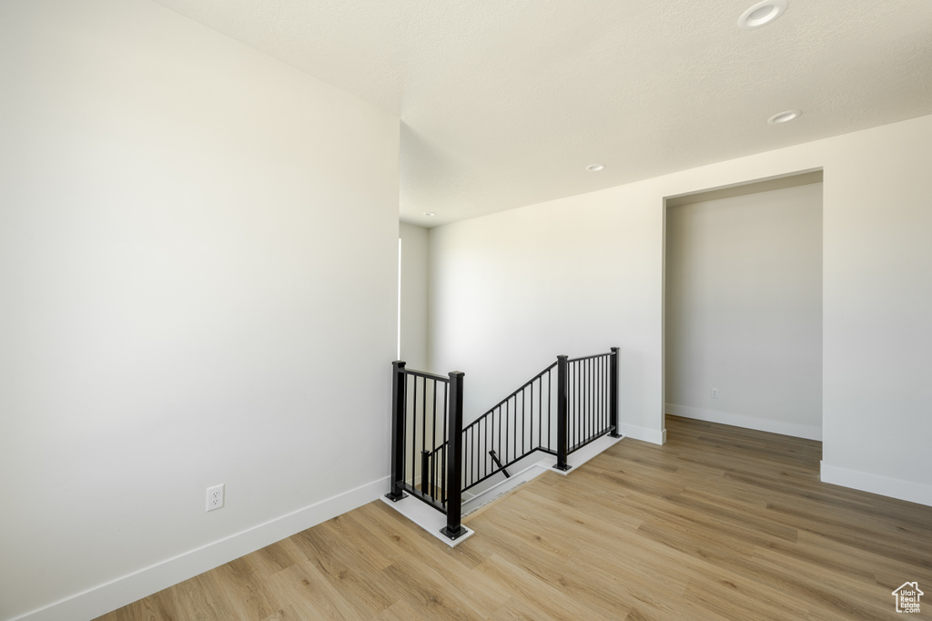 Unfurnished room with light wood-type flooring