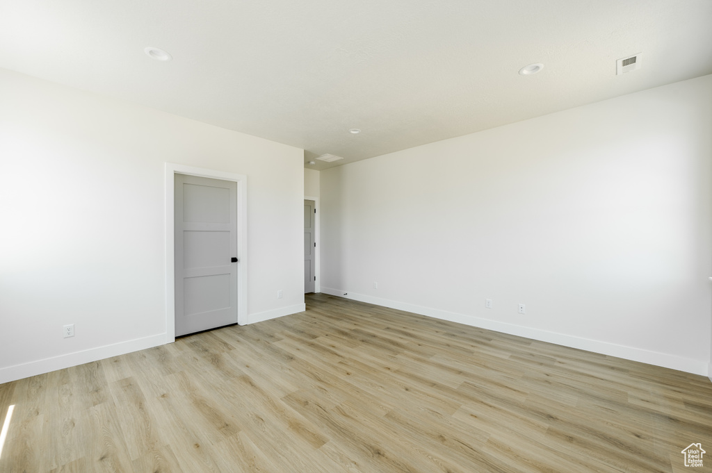 Unfurnished room with light hardwood / wood-style floors