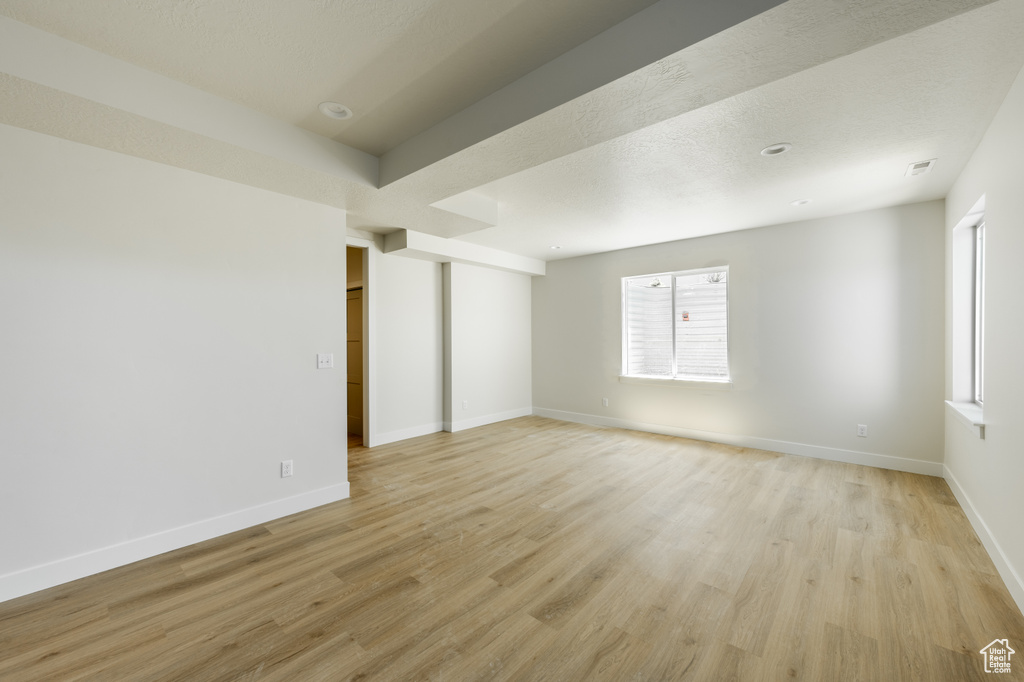 Unfurnished room featuring light wood-type flooring