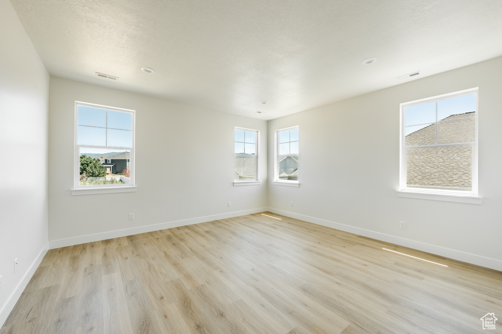 Spare room with light wood-type flooring