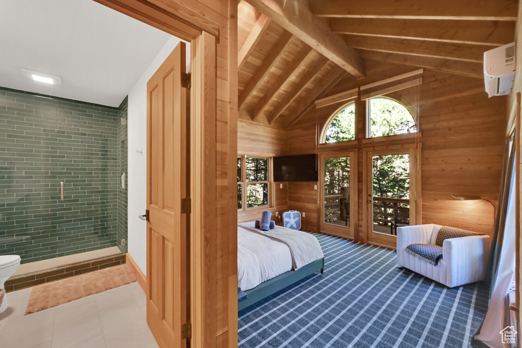 Tiled bedroom with brick wall, wood walls, wooden ceiling, and vaulted ceiling with beams