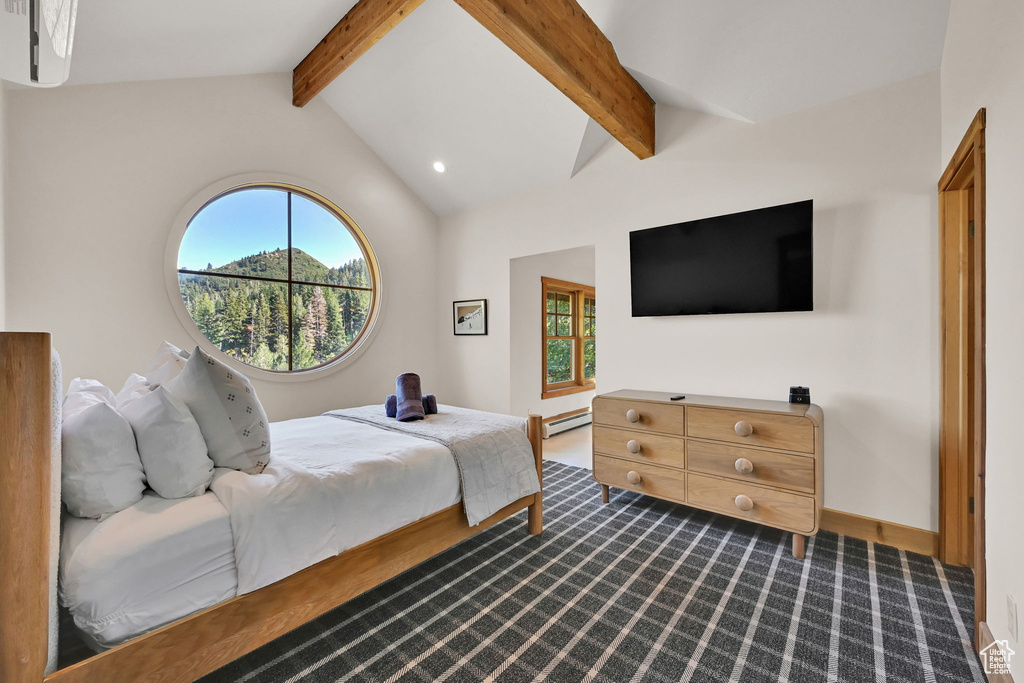 Bedroom with a baseboard radiator, hardwood / wood-style floors, and lofted ceiling with beams