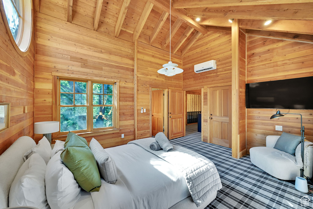 Bedroom with wooden walls, carpet flooring, wood ceiling, high vaulted ceiling, and beam ceiling