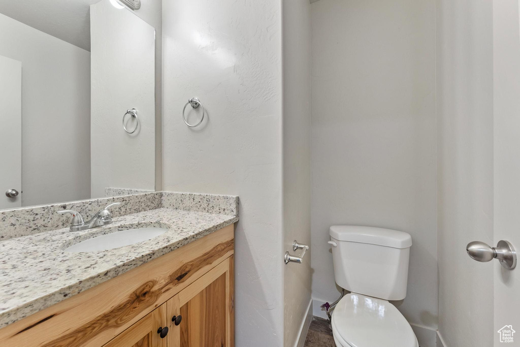 Bathroom featuring vanity and toilet