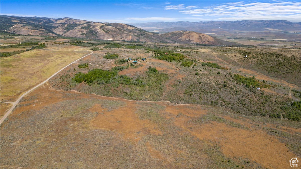 Birds eye view of property featuring a mountain view