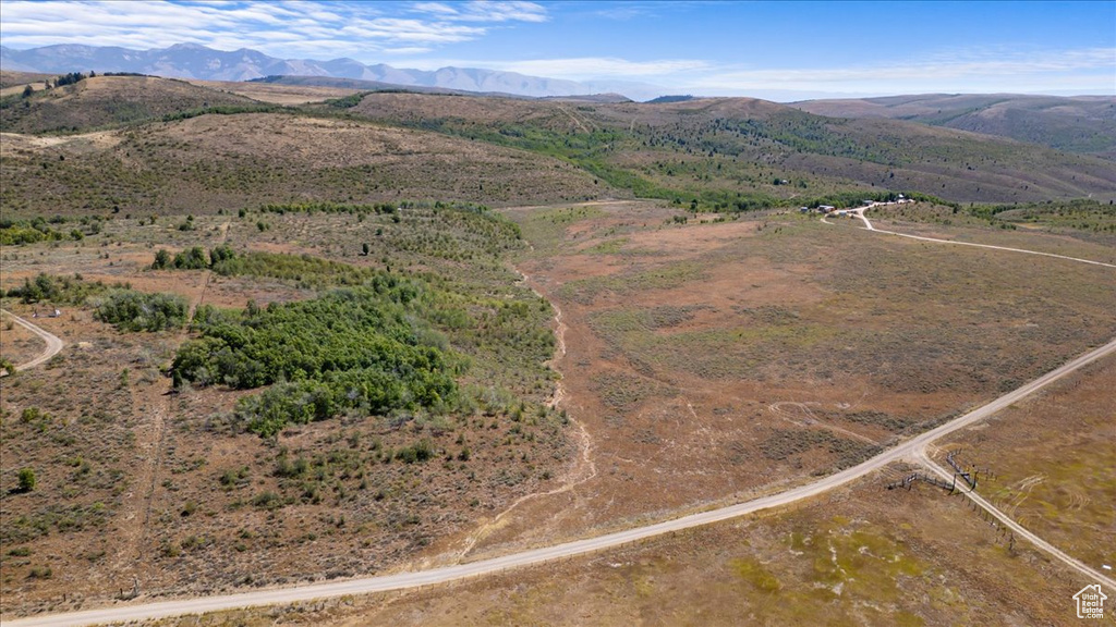 Birds eye view of property with a mountain view