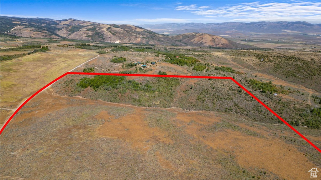 Birds eye view of property with a mountain view