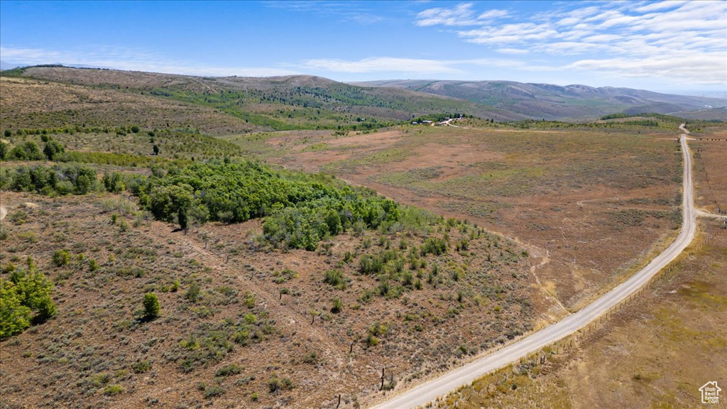 Birds eye view of property featuring a mountain view and a rural view