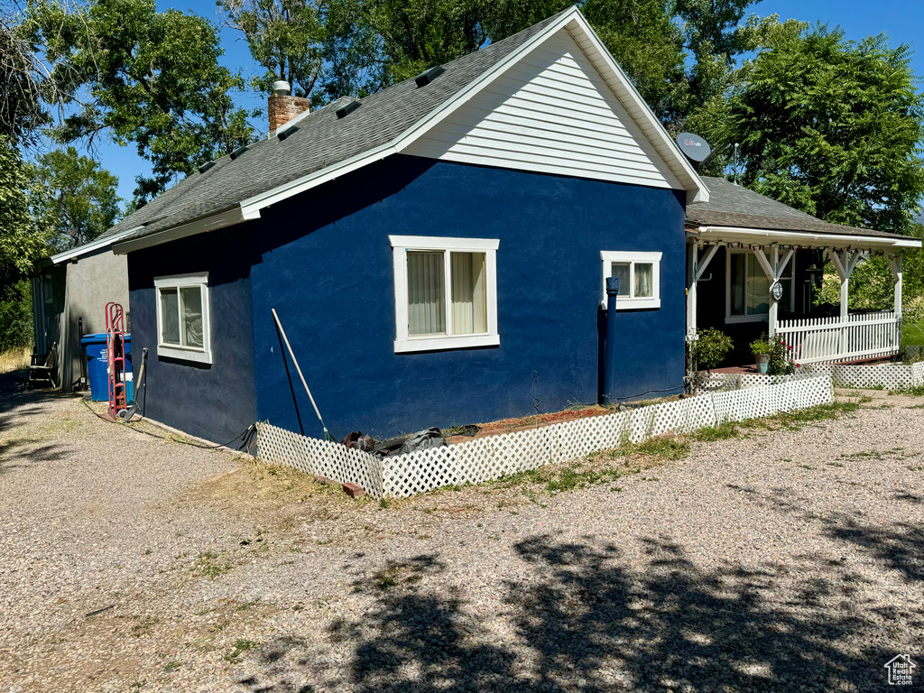 View of property exterior with a porch