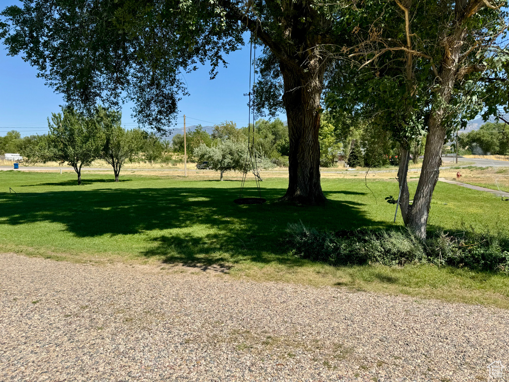 View of property\\\'s community featuring a lawn