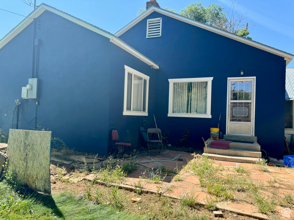 View of front of house with a patio