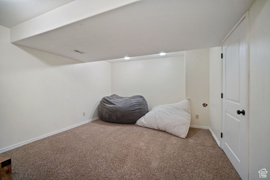 Living area with carpet flooring