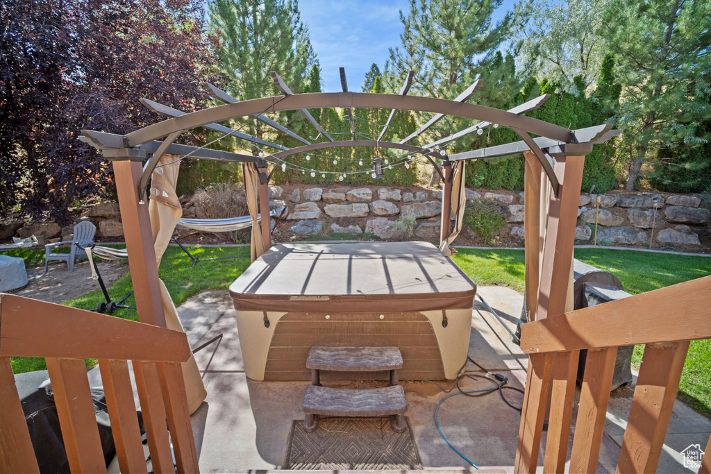 View of patio / terrace featuring a hot tub