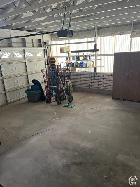 Garage featuring a garage door opener