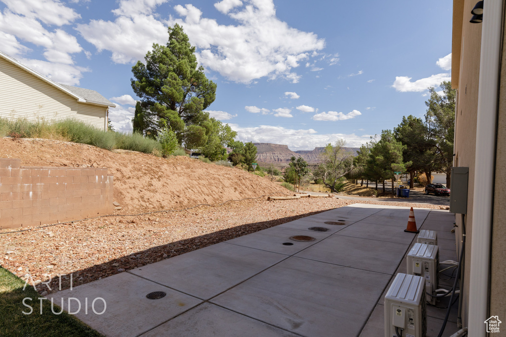 Exterior space with a mountain view and a patio