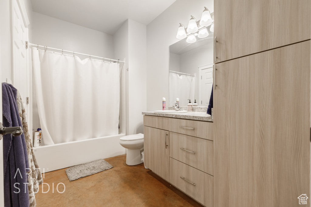 Full bathroom featuring shower / tub combo with curtain, toilet, vanity, and tile patterned floors