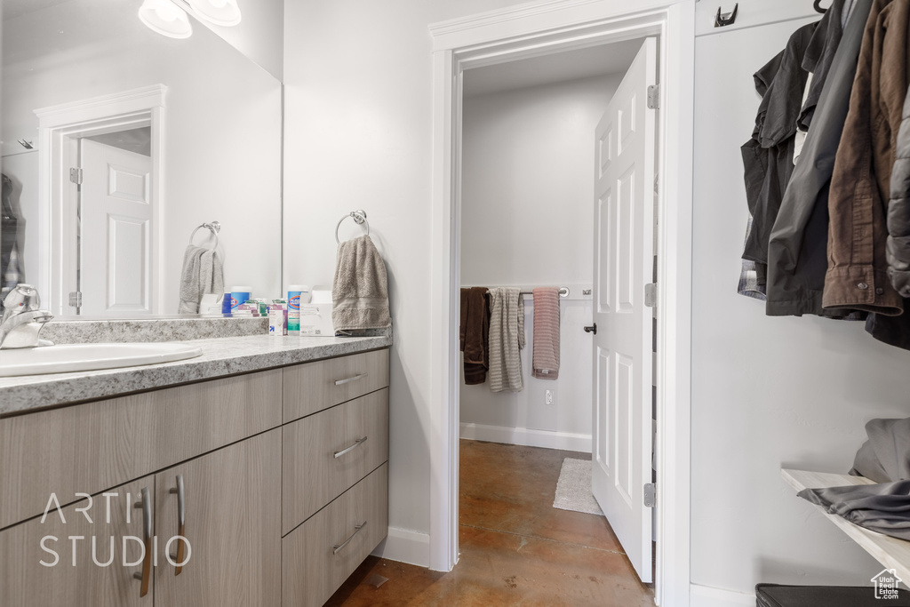 Bathroom with tile patterned flooring and vanity