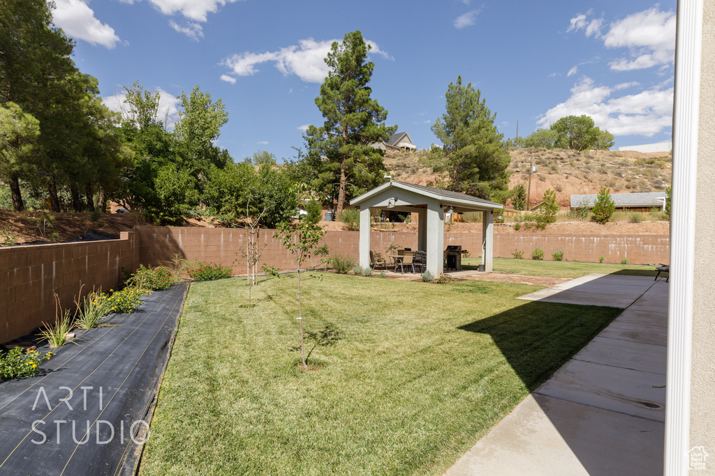 View of yard featuring a gazebo and a patio area