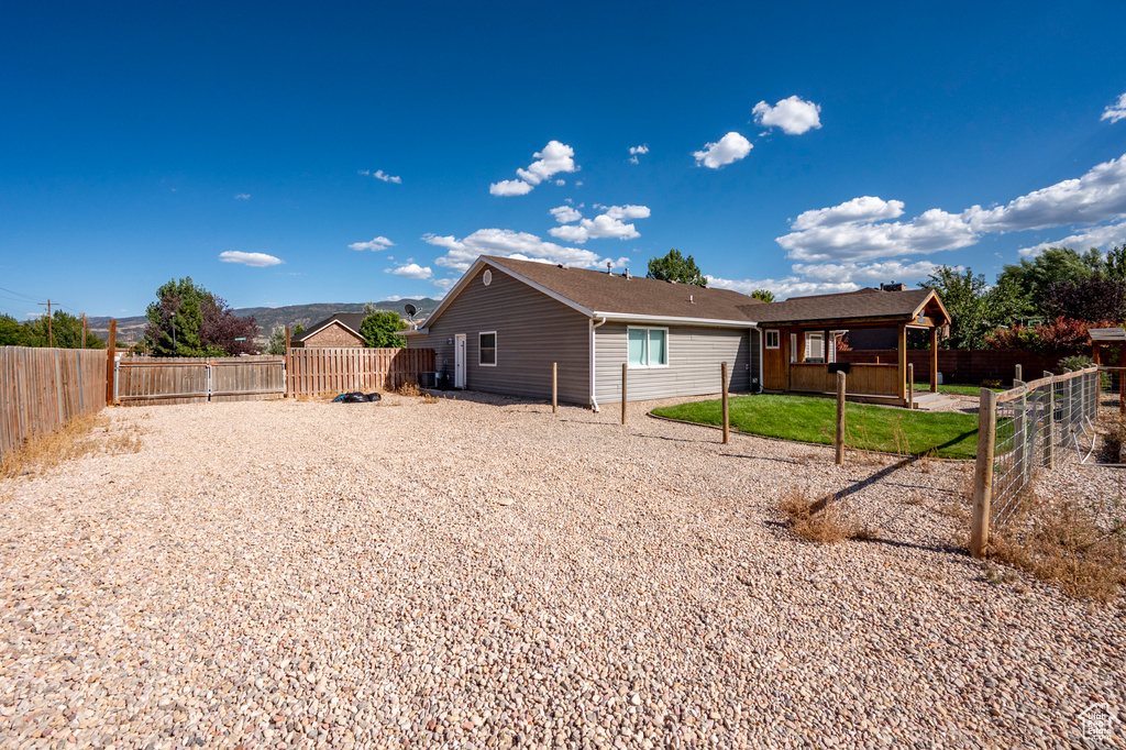 View of side of home featuring a mountain view