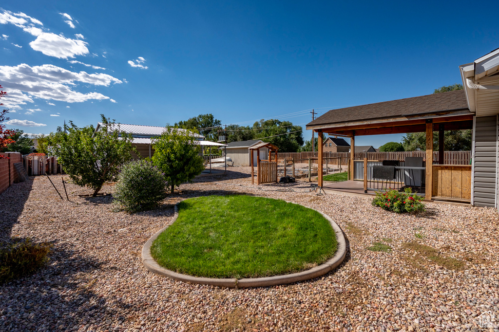 View of yard featuring a storage unit