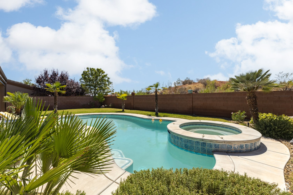 View of pool featuring an in ground hot tub