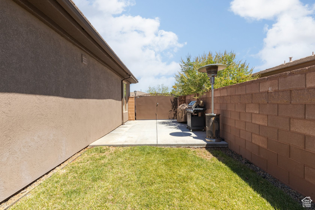 View of yard with a patio