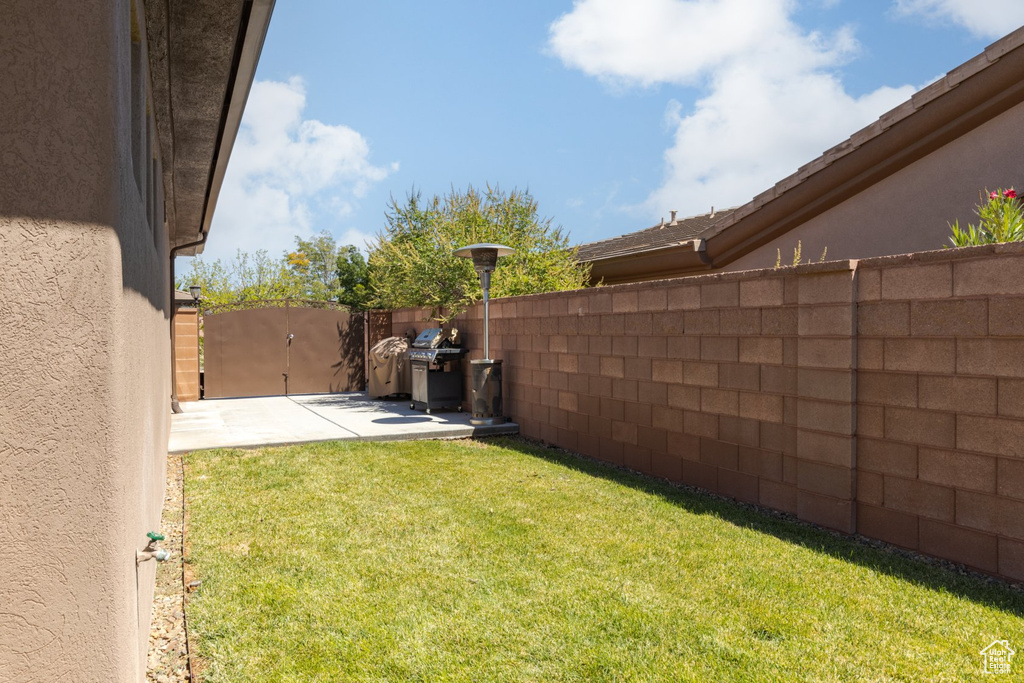 View of yard with a patio