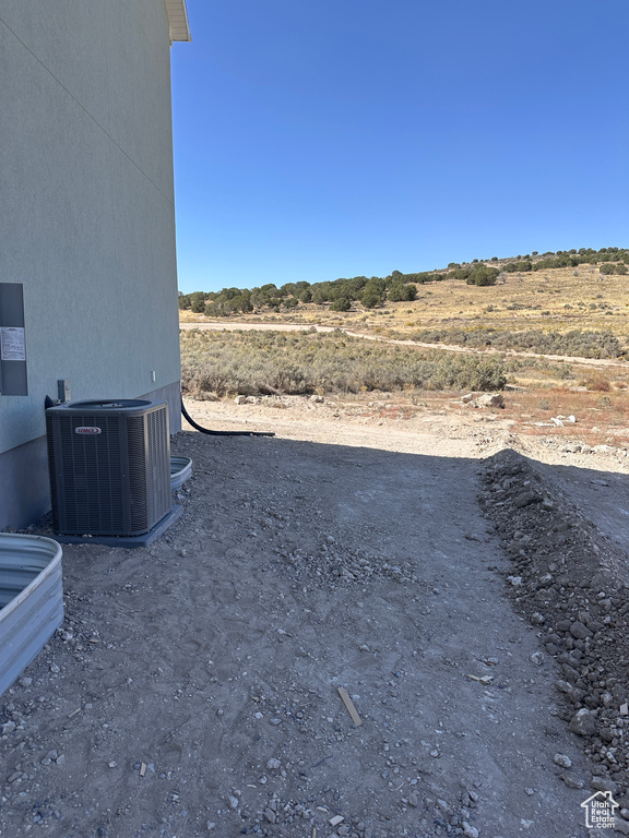 View of yard with central air condition unit