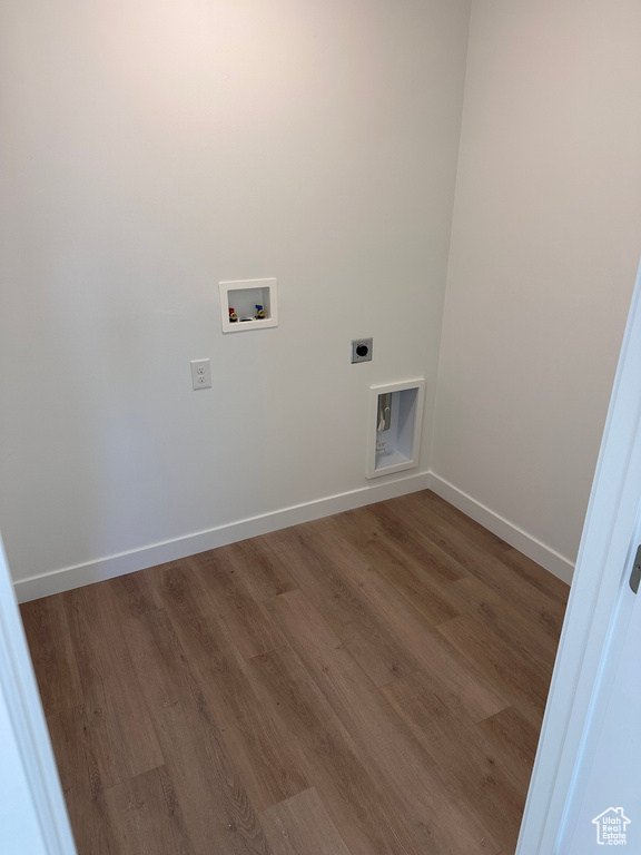 Washroom with washer hookup, hardwood / wood-style flooring, and hookup for an electric dryer