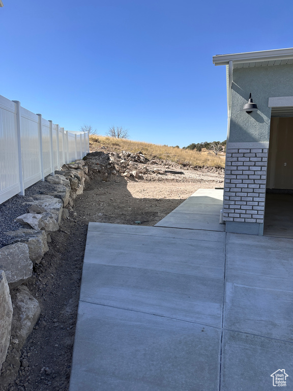 View of yard with a patio