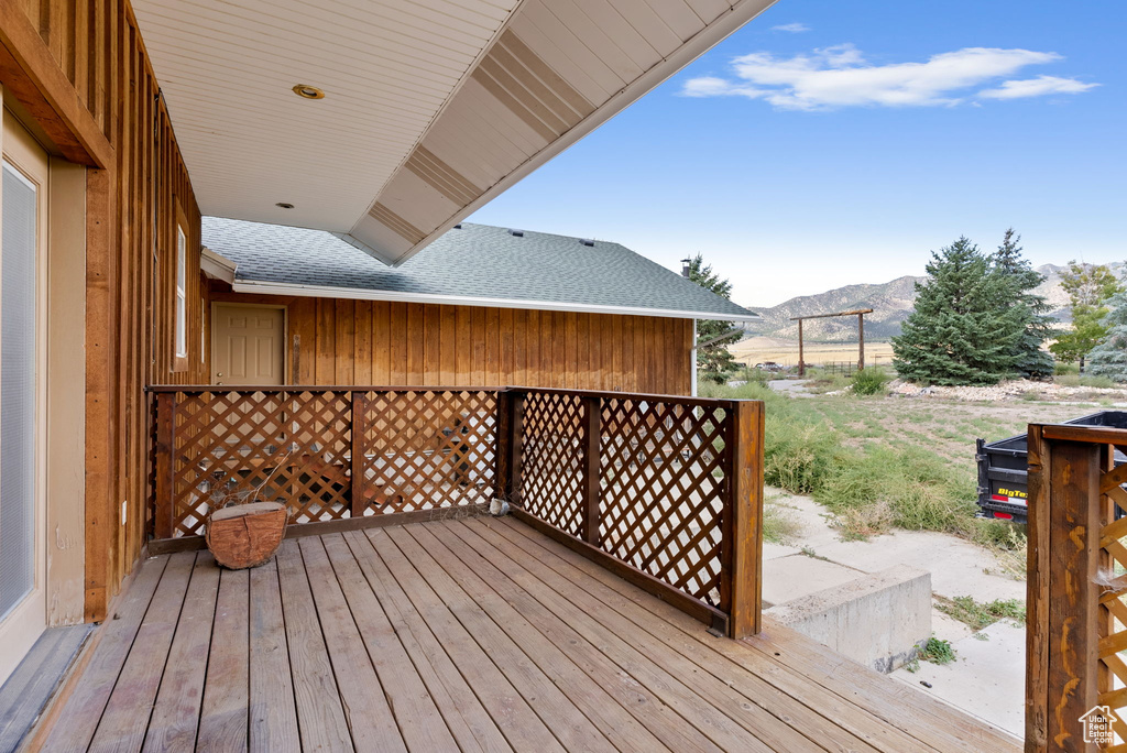 Wooden deck featuring a mountain view