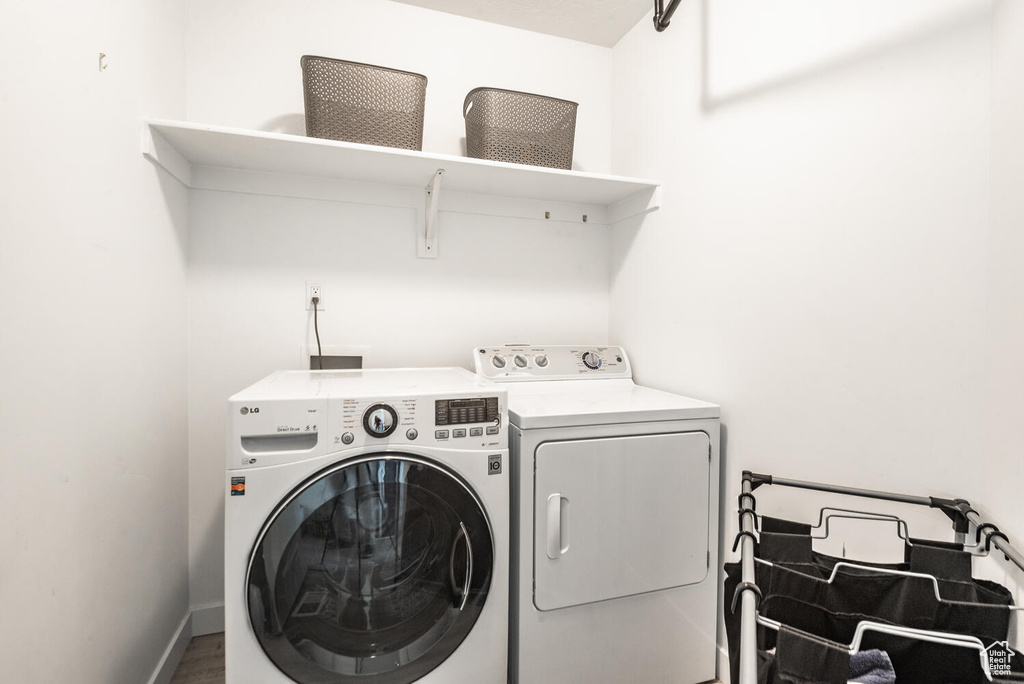 Washroom featuring washing machine and clothes dryer