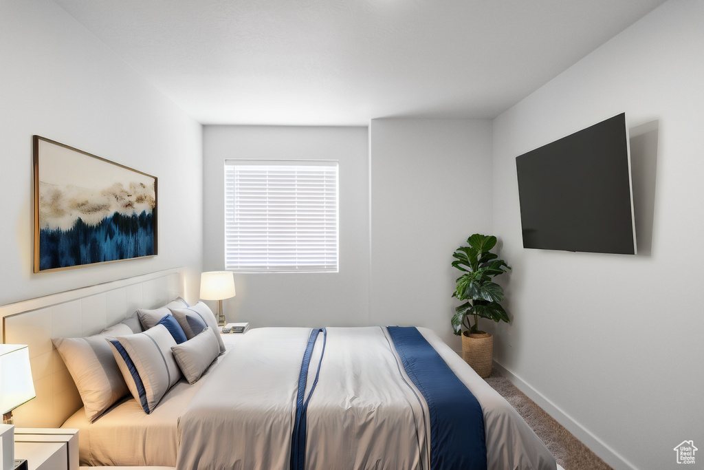 Bedroom with carpet flooring