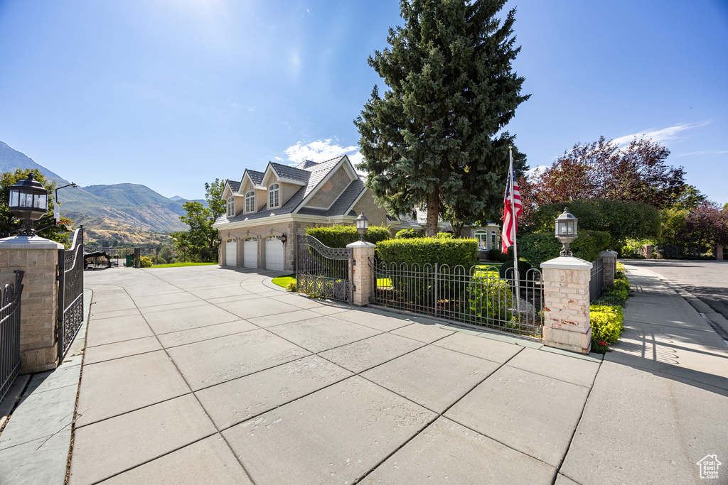 View of patio / terrace with a mountain view and a garage