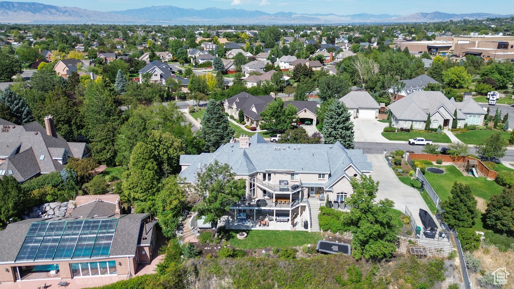 Birds eye view of property with a mountain view