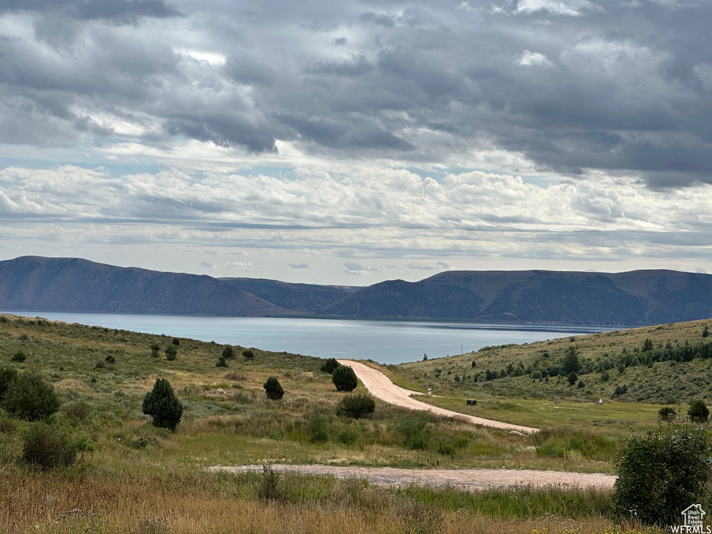 Property view of mountains with a water view