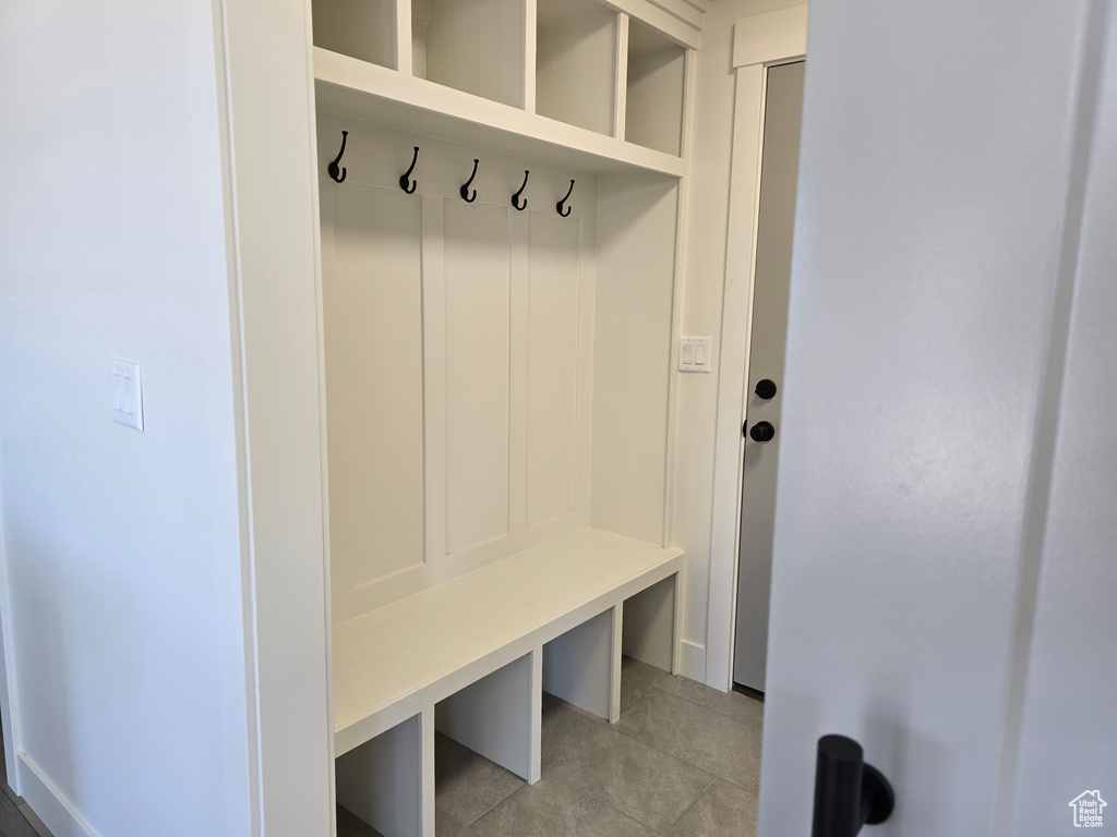 Mudroom featuring light tile patterned flooring