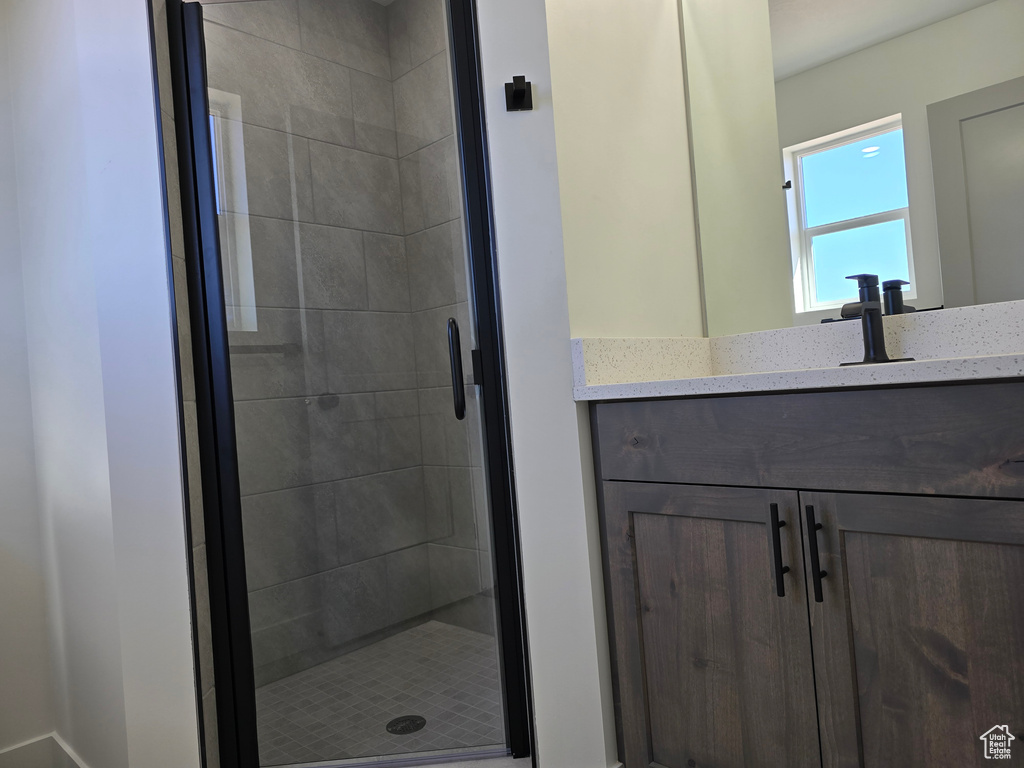 Bathroom with vanity and an enclosed shower