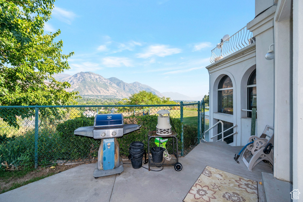 View of patio / terrace with a mountain view and area for grilling