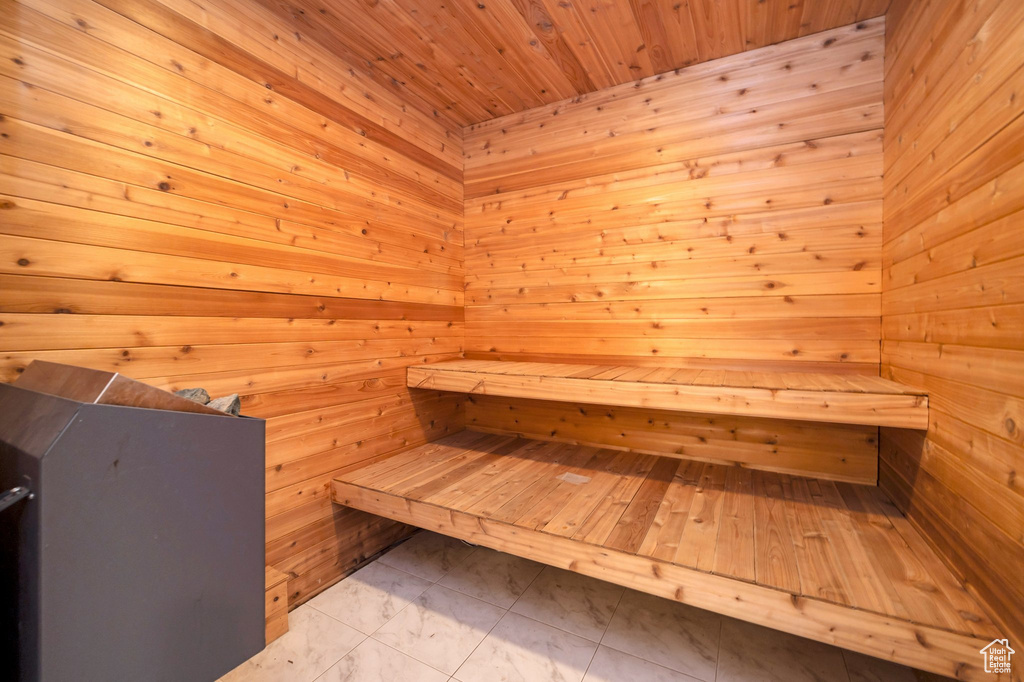 View of sauna featuring wooden walls