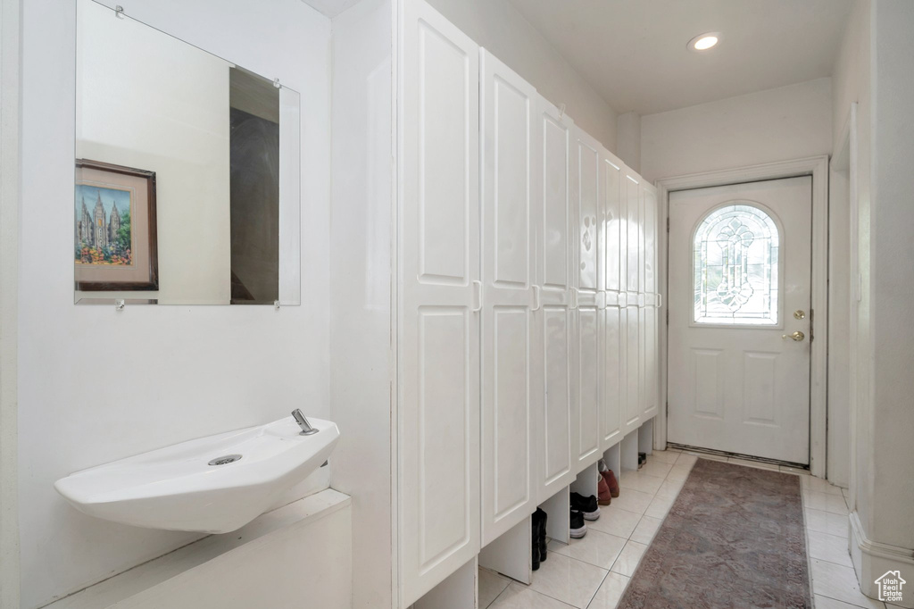 Mudroom featuring light tile patterned floors