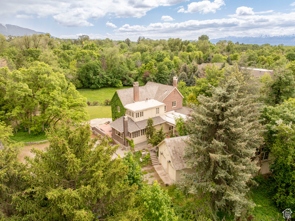 View of subject property featuring a heavily wooded area