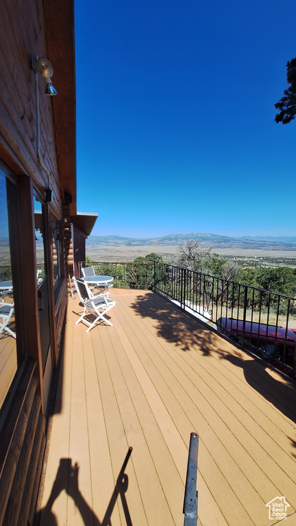 Wooden deck featuring a mountain view