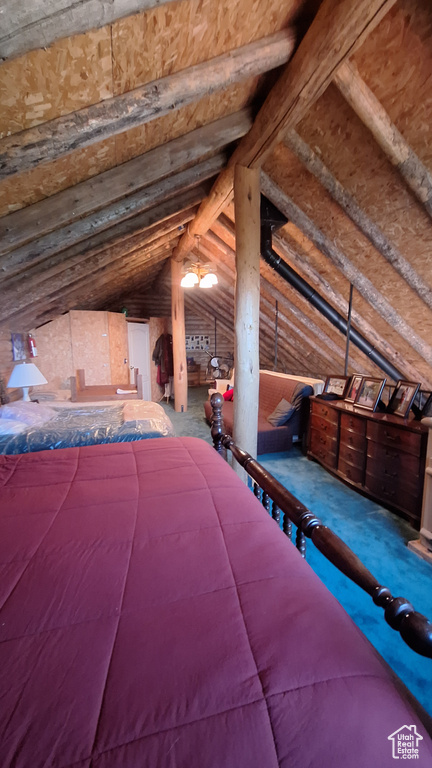 Unfurnished bedroom with lofted ceiling