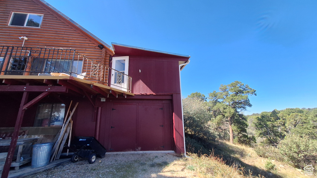 Rear view of property with a balcony