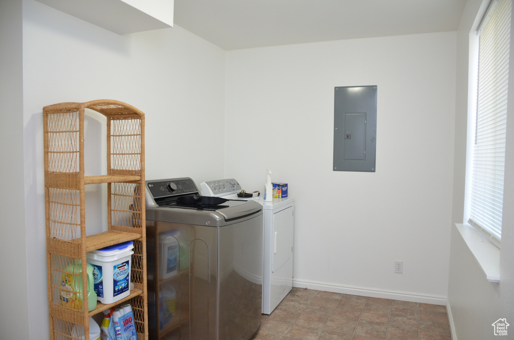 Washroom with electric panel and washer and clothes dryer